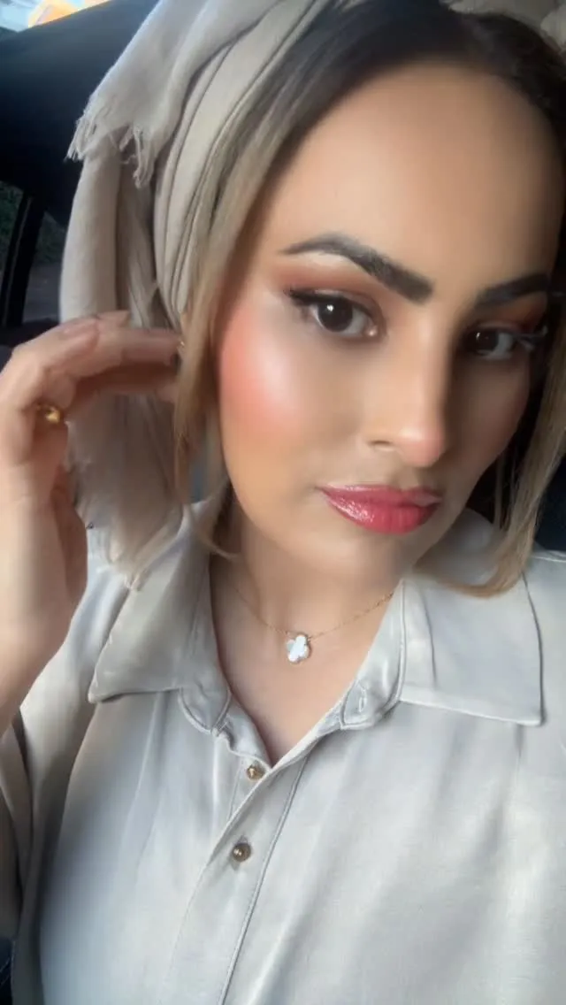 A client with glowing skin and soft-glam make-up